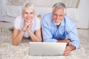 bigstockphoto_happy_senior_couple_lying_down_4902020