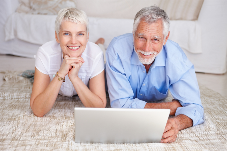 bigstockphoto_happy_senior_couple_lying_down_4902020