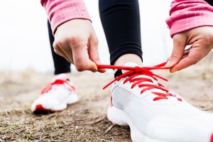 Woman Runner Tying Sport Shoes