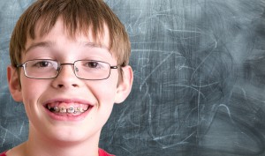 Student In Front Of Chalkboard