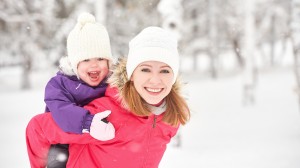 Happy Family Mother And Baby Girl Daughter Playing And Laughing