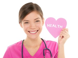 Medical nurse doctor woman showing HEALTH sign on heart. Health