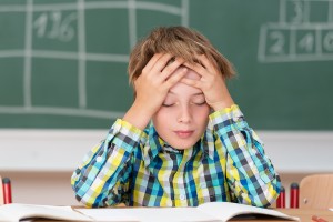 Young Boy Concentrating On His Schoolwork