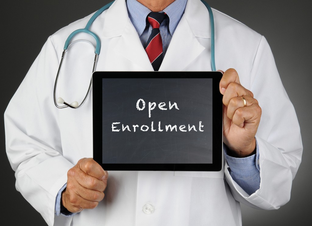 Closeup of a doctor holding a tablet computer with a chalkboard