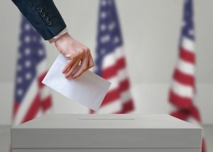 Election In United States Of America. Voter Holds Envelope In Ha