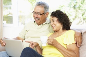 Senior Couple Using Laptop At Home